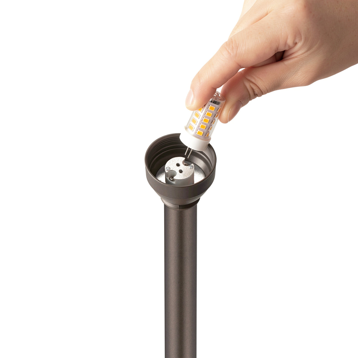 HIBOITEC China Hat Path Light in oil rubbed bronze — G4 bulb being removed from the socket