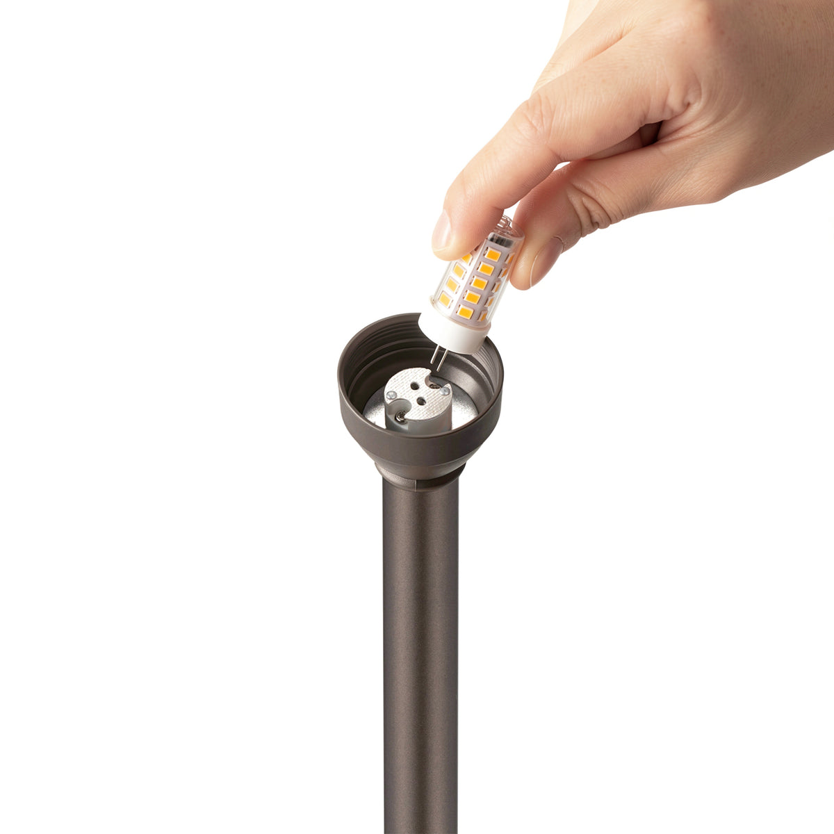 HIBOITEC Pagoda Path Light in oil rubbed bronze — G4 bulb being removed from the socket